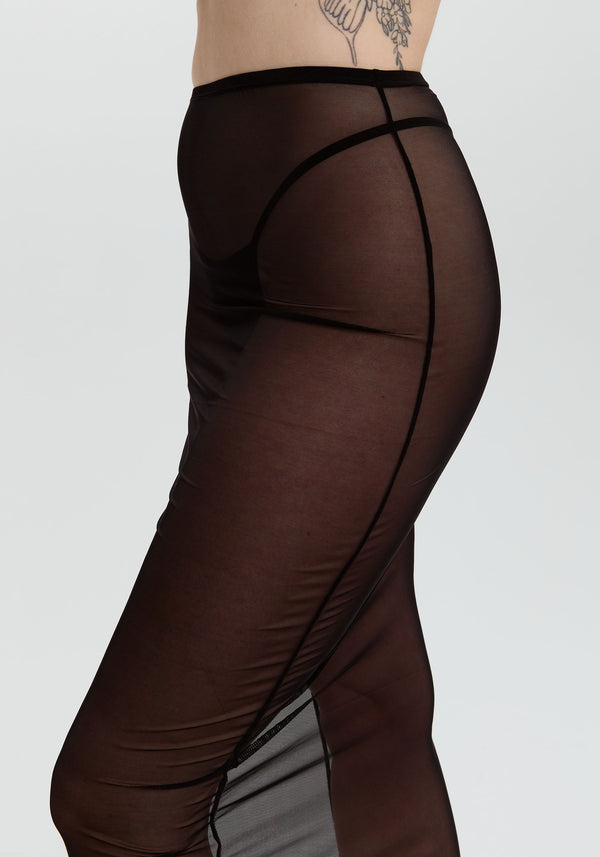model is wearing an S skirt-black gaia midi skirt