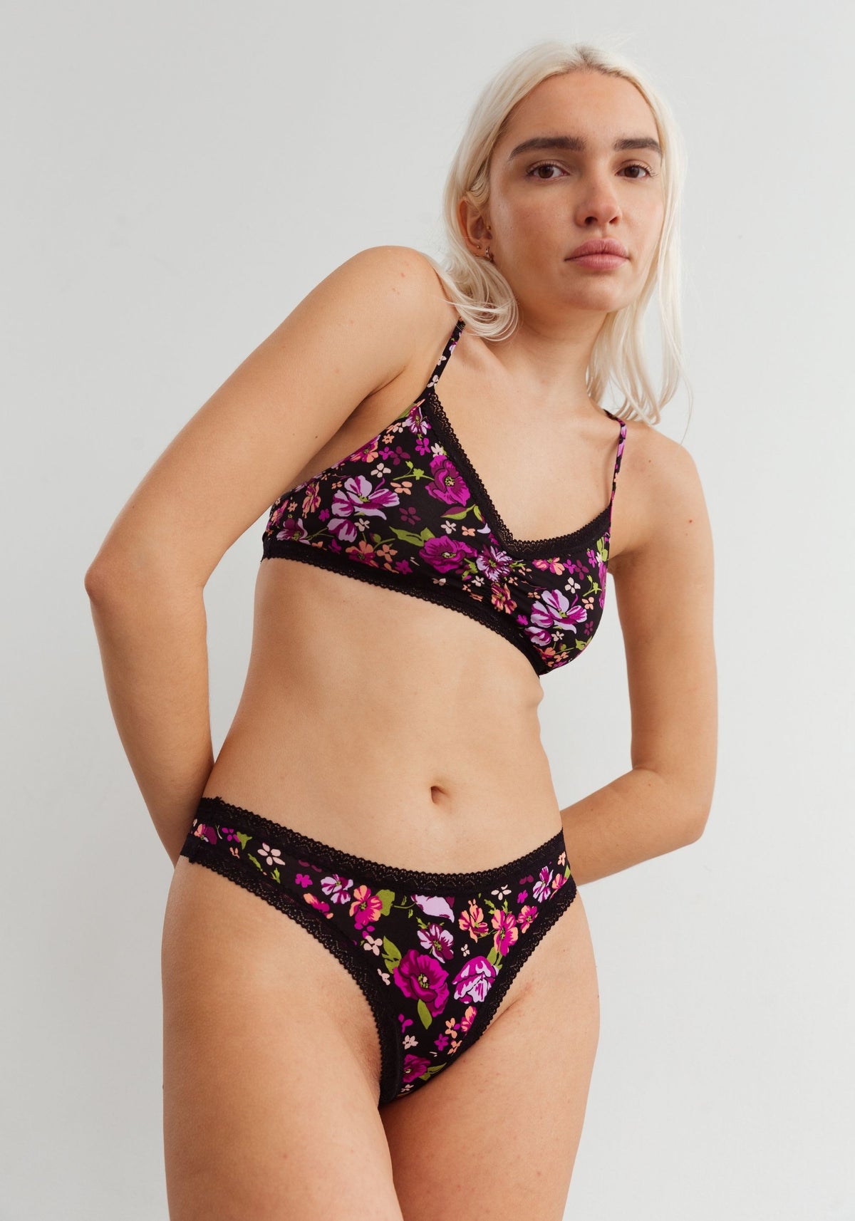 model is wearing an S panty-black,multi the micro lace trim thong