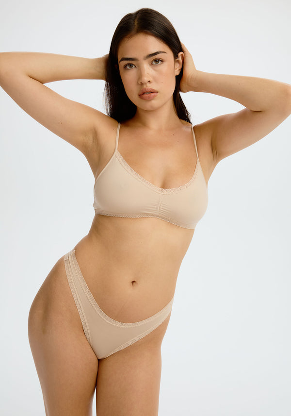 model is wearing an S panty - nude the micro lace trim thong