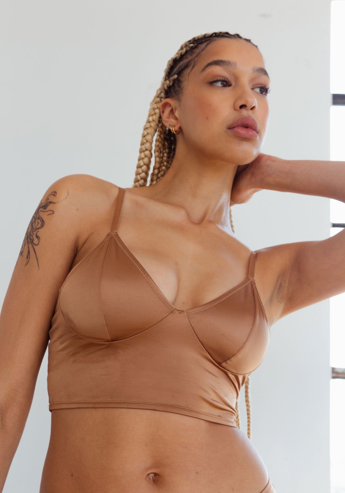 model is wearing an M cami -brown shade crop cami