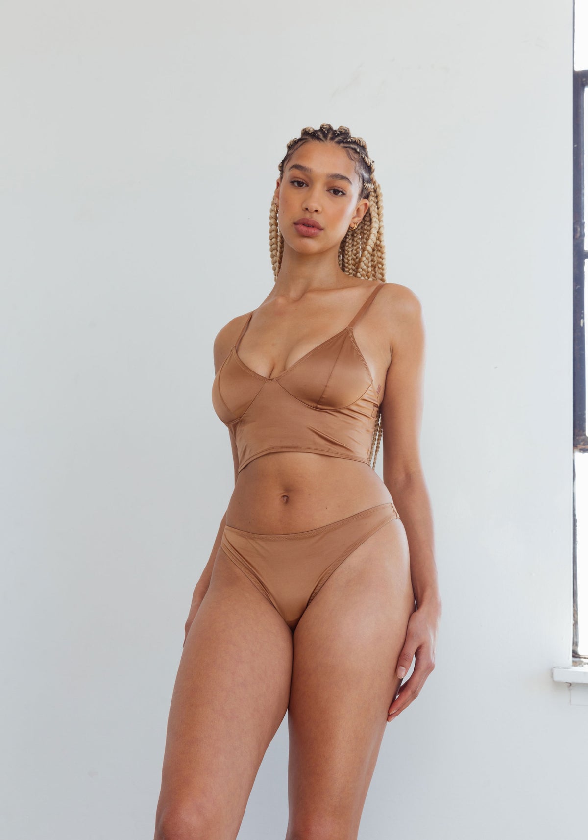 model is wearing an M cami -brown shade crop cami