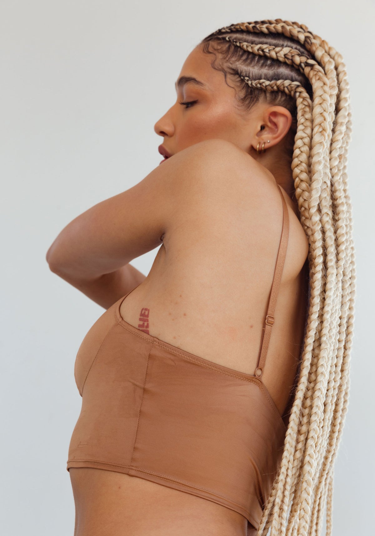 model is wearing an M cami -brown shade crop cami