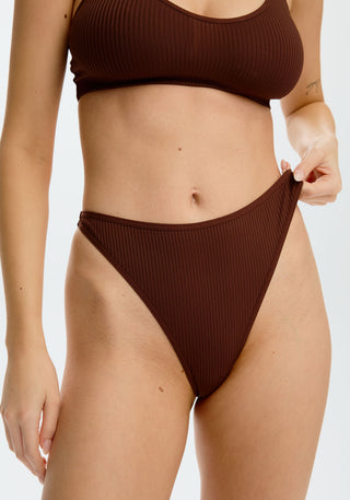 model is wearing an S panty - brown the rib high leg thong