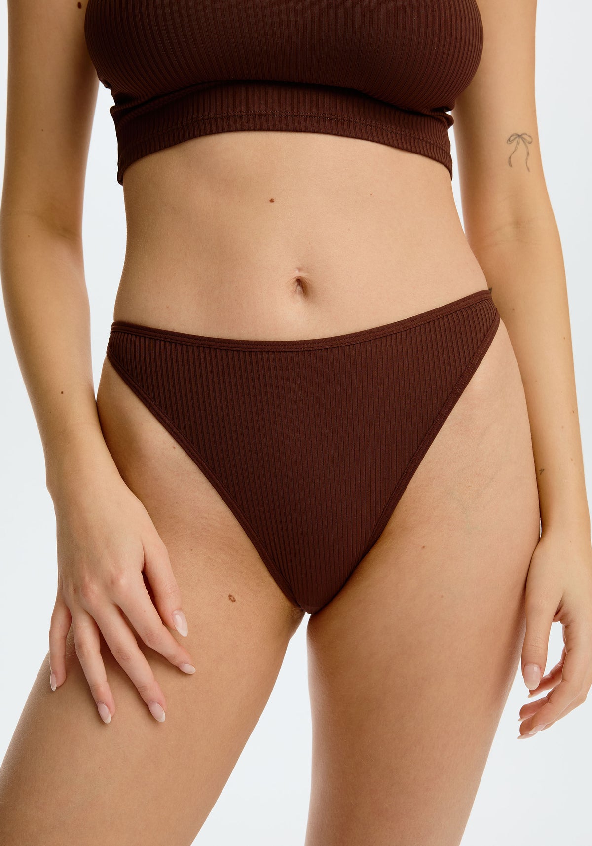 model is wearing an S panty - brown the rib high leg bikini