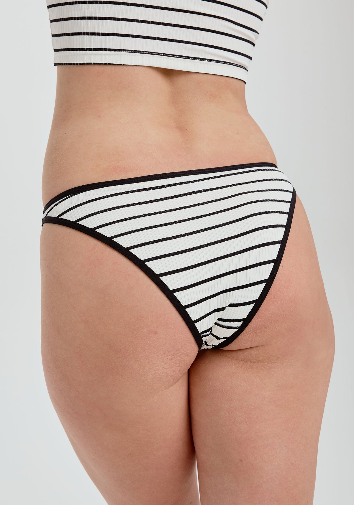 model is wearing an S panty - black,multi,white the rib high leg bikini