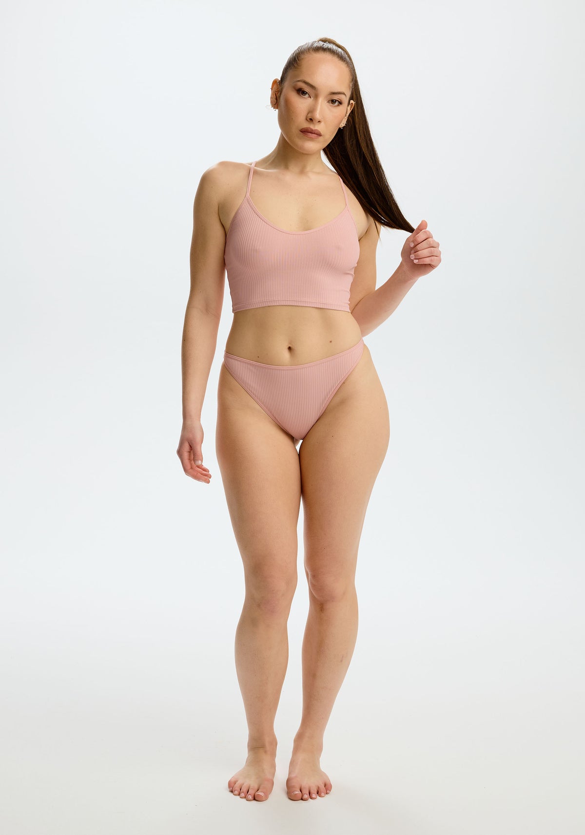 model is wearing an M panty - pink the rib high leg bikini