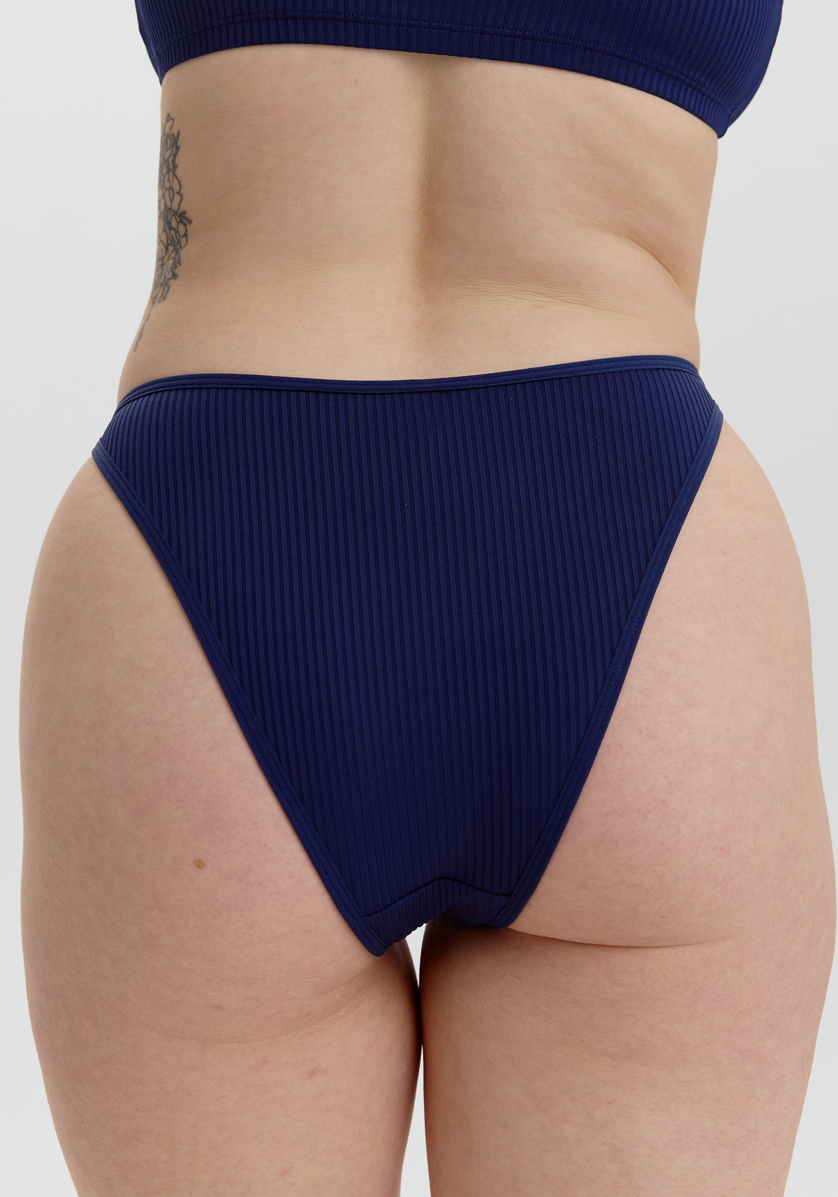 model is wearing an S panty - blue the rib high leg bikini