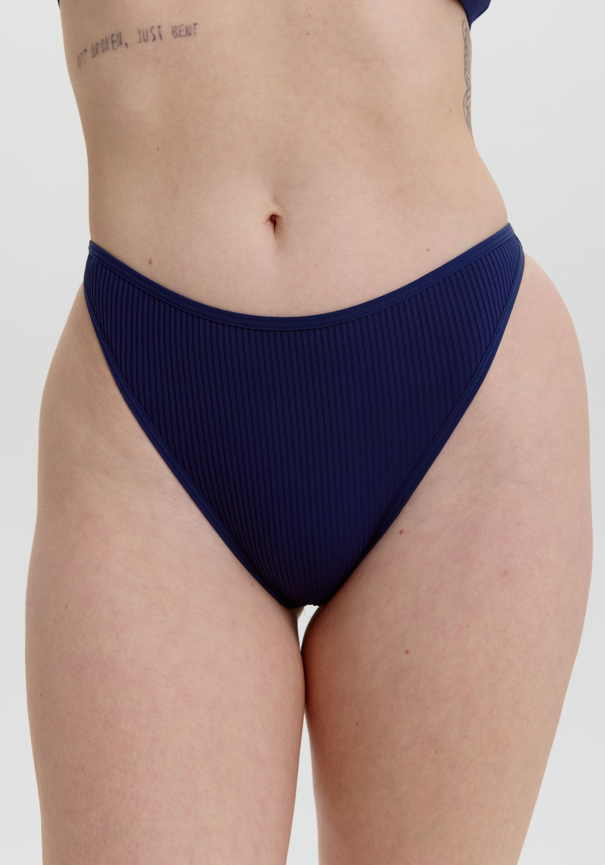 model is wearing an S panty - blue the rib high leg bikini