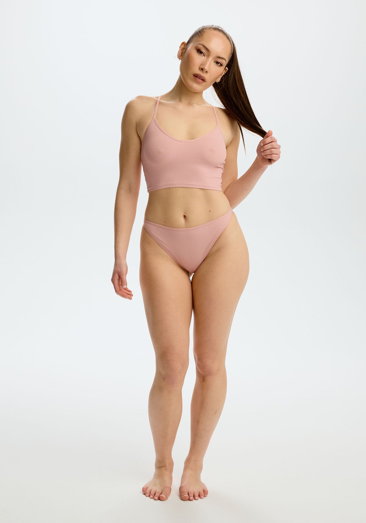 model is wearing an S cami - pink the rib crop cami