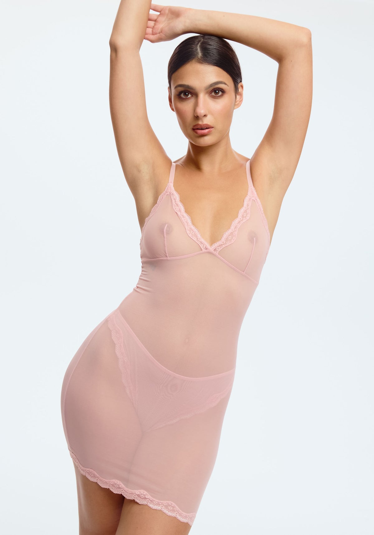 model is wearing an S slip-pink lotus slip