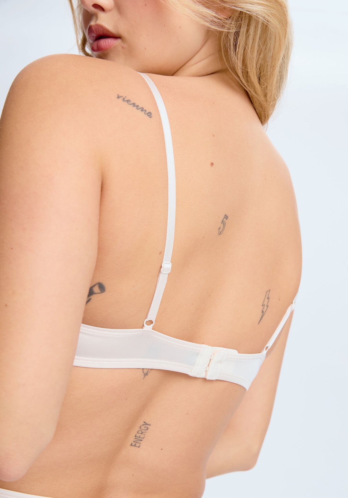 model is wearing an S bralette-nude phantom bralette