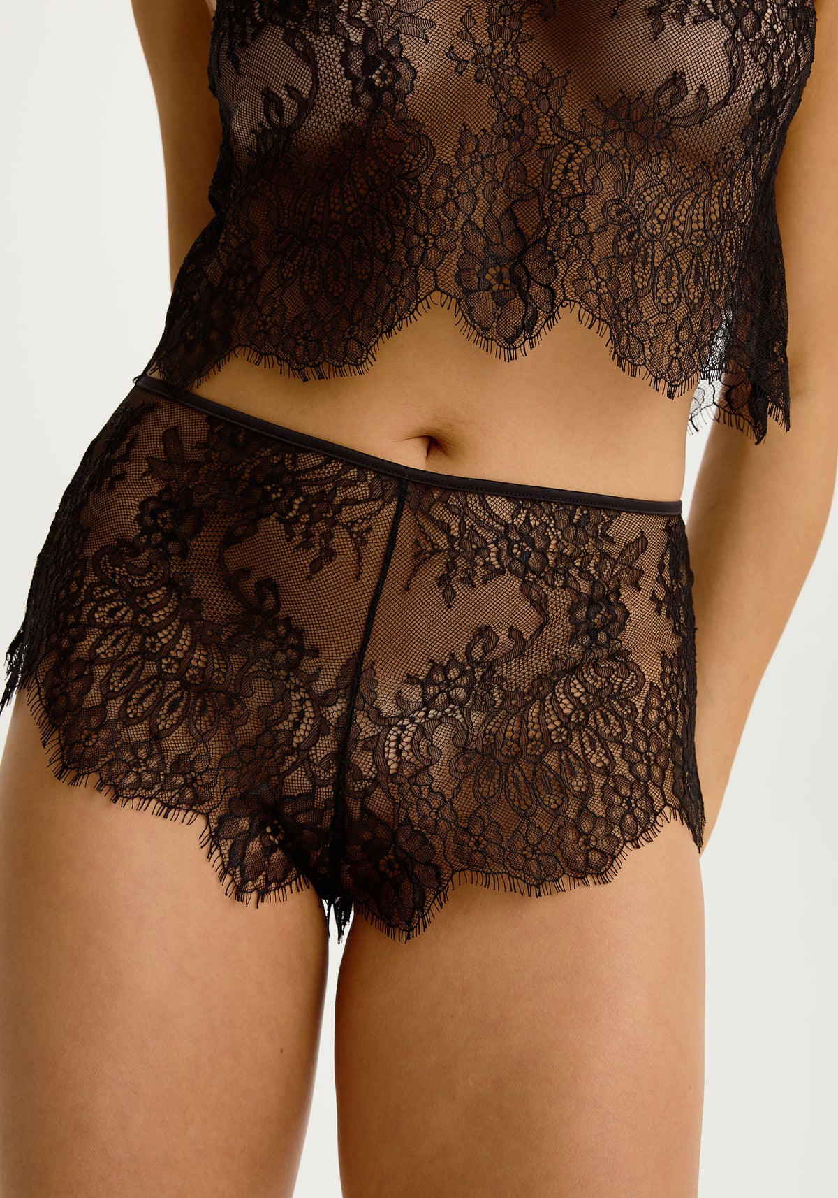 model is wearing an XS short - black serene short