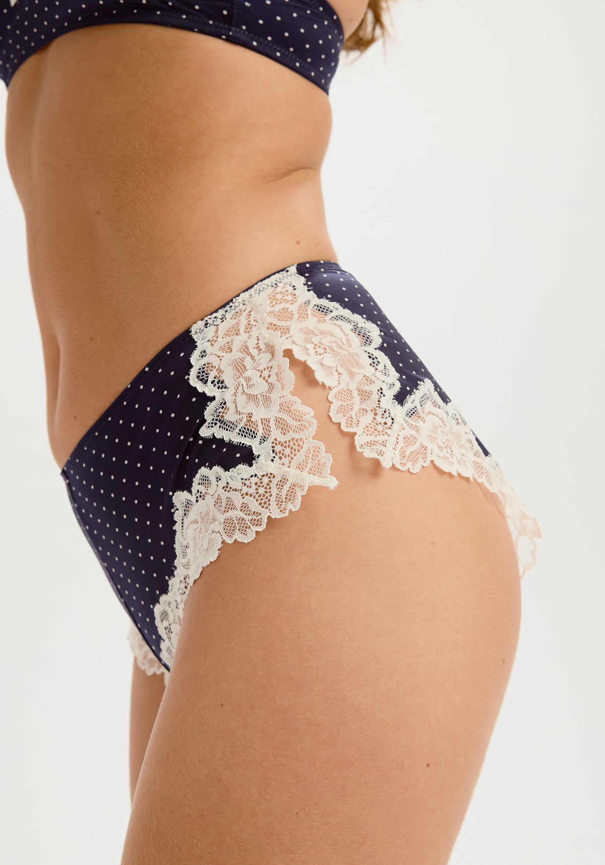 model is wearing an S panty - blue,multi luster tap short