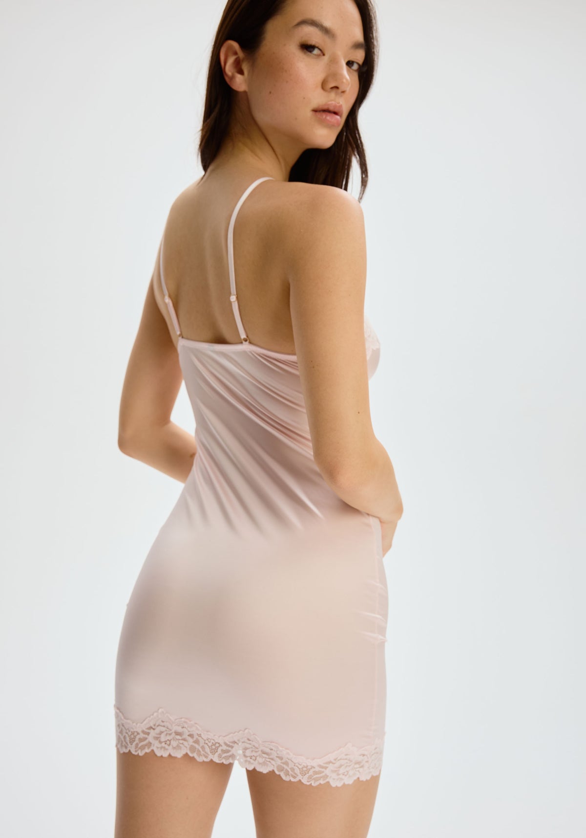 model is wearing an S slip-pink luster slip