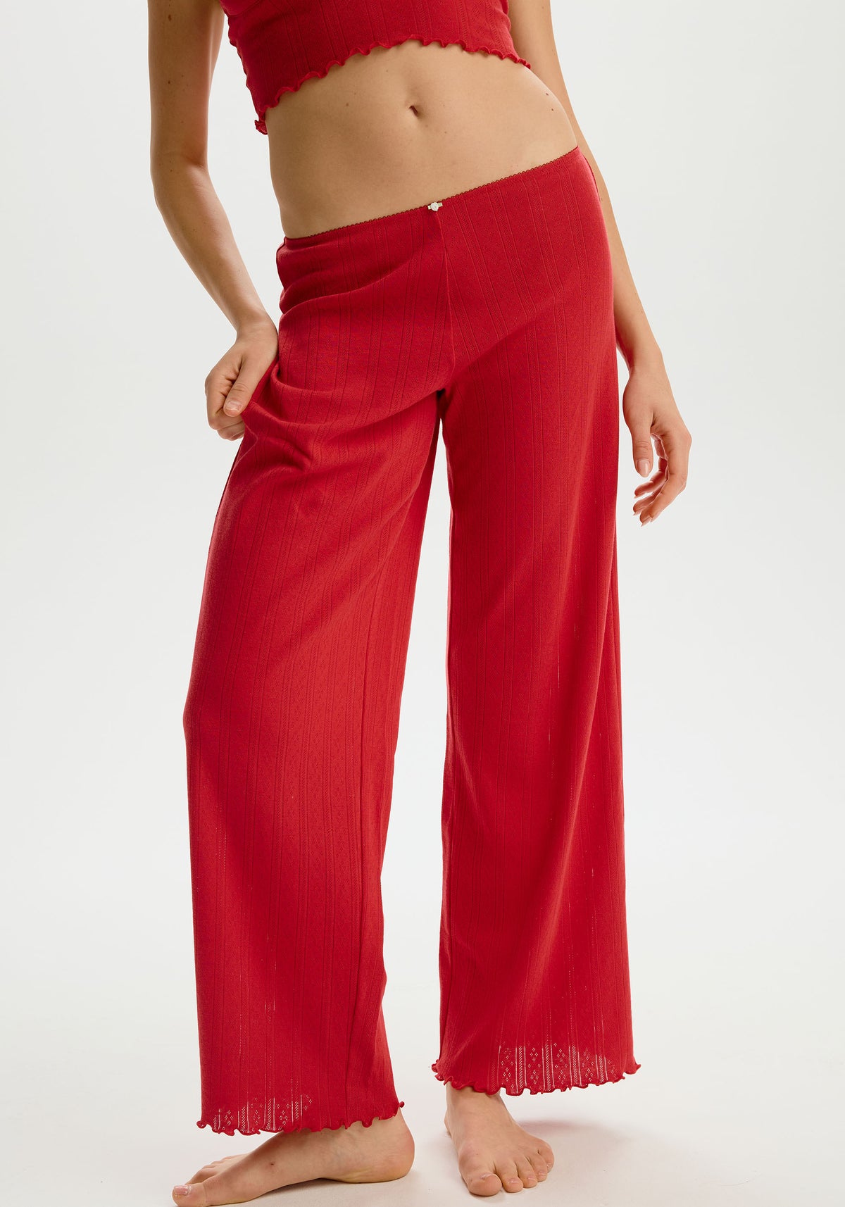 model is wearing an S pant - red dream cotton pointelle pant