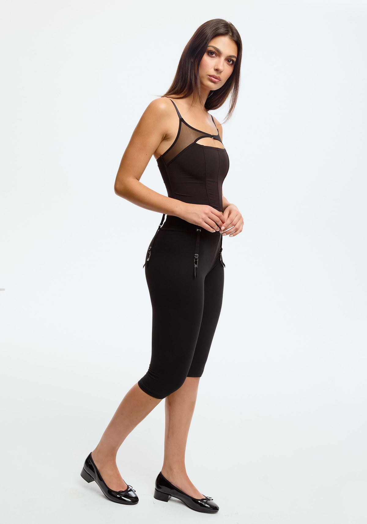 model is wearing an S corset-black orbit corset