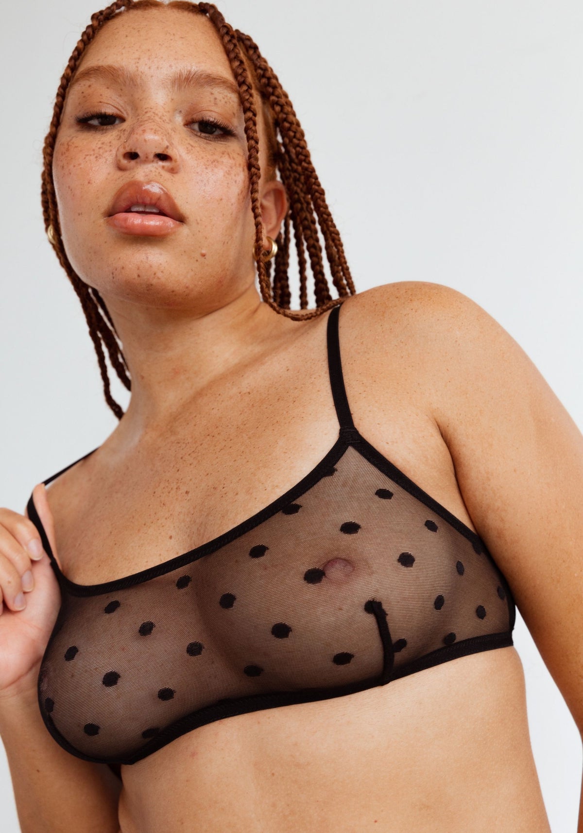 model is wearing an M bralette-black obsidian bralette