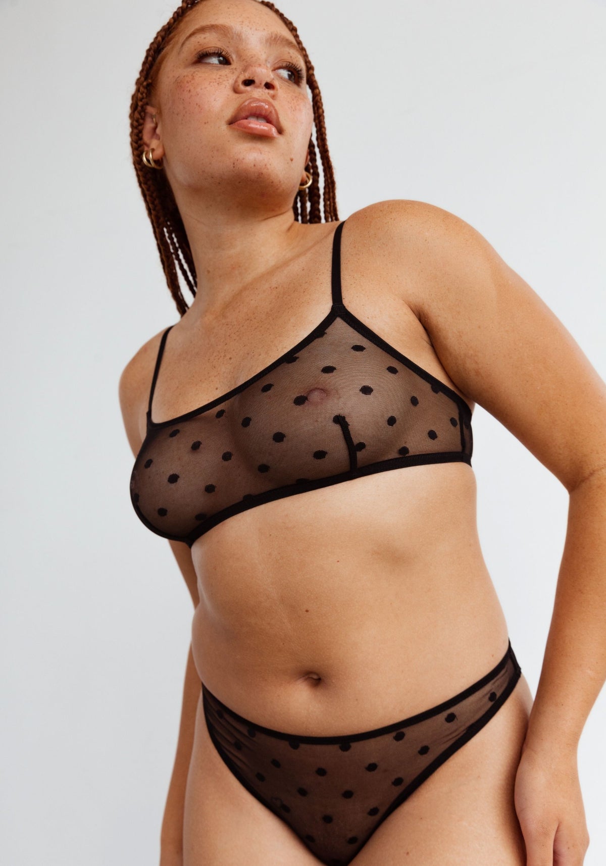 model is wearing an M bralette-black obsidian bralette
