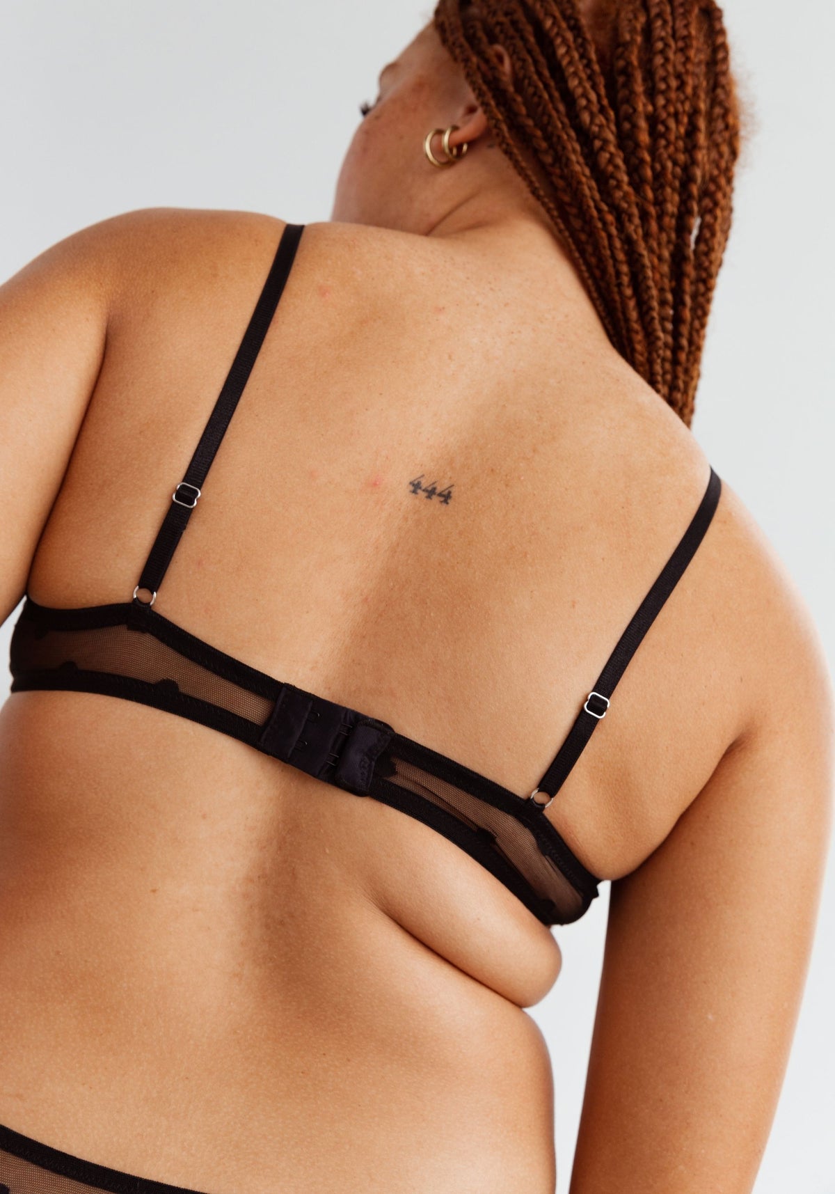 model is wearing an M bralette-black obsidian bralette