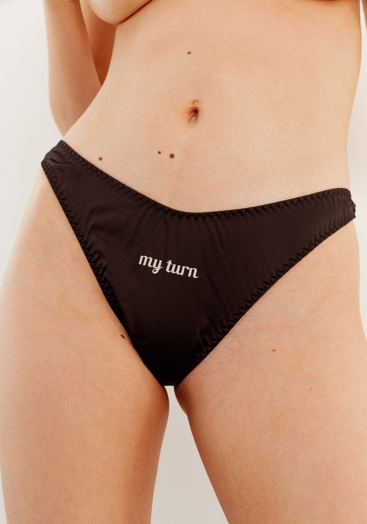 model is wearing an S panty-black play thong