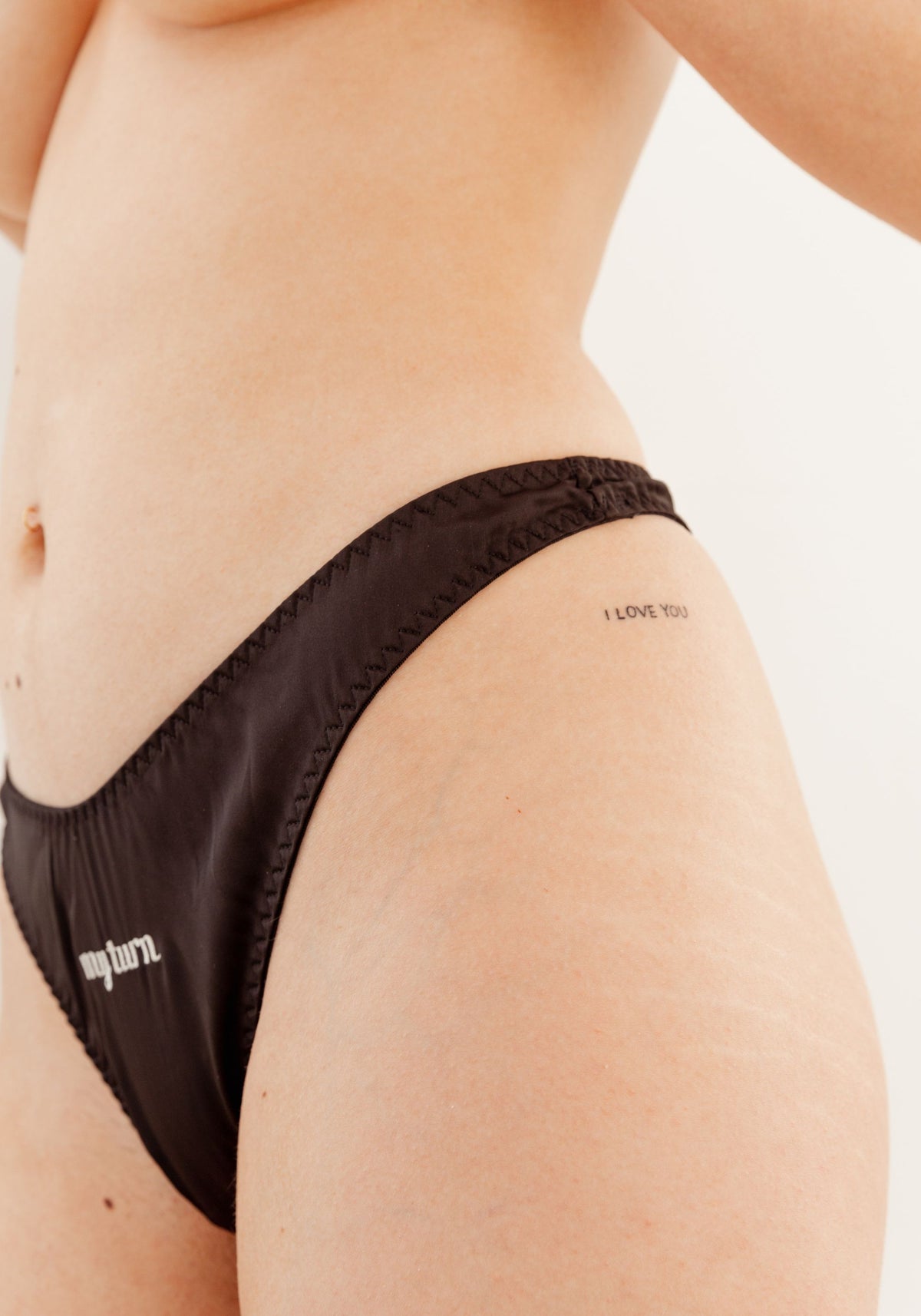 model is wearing an S panty-black play thong
