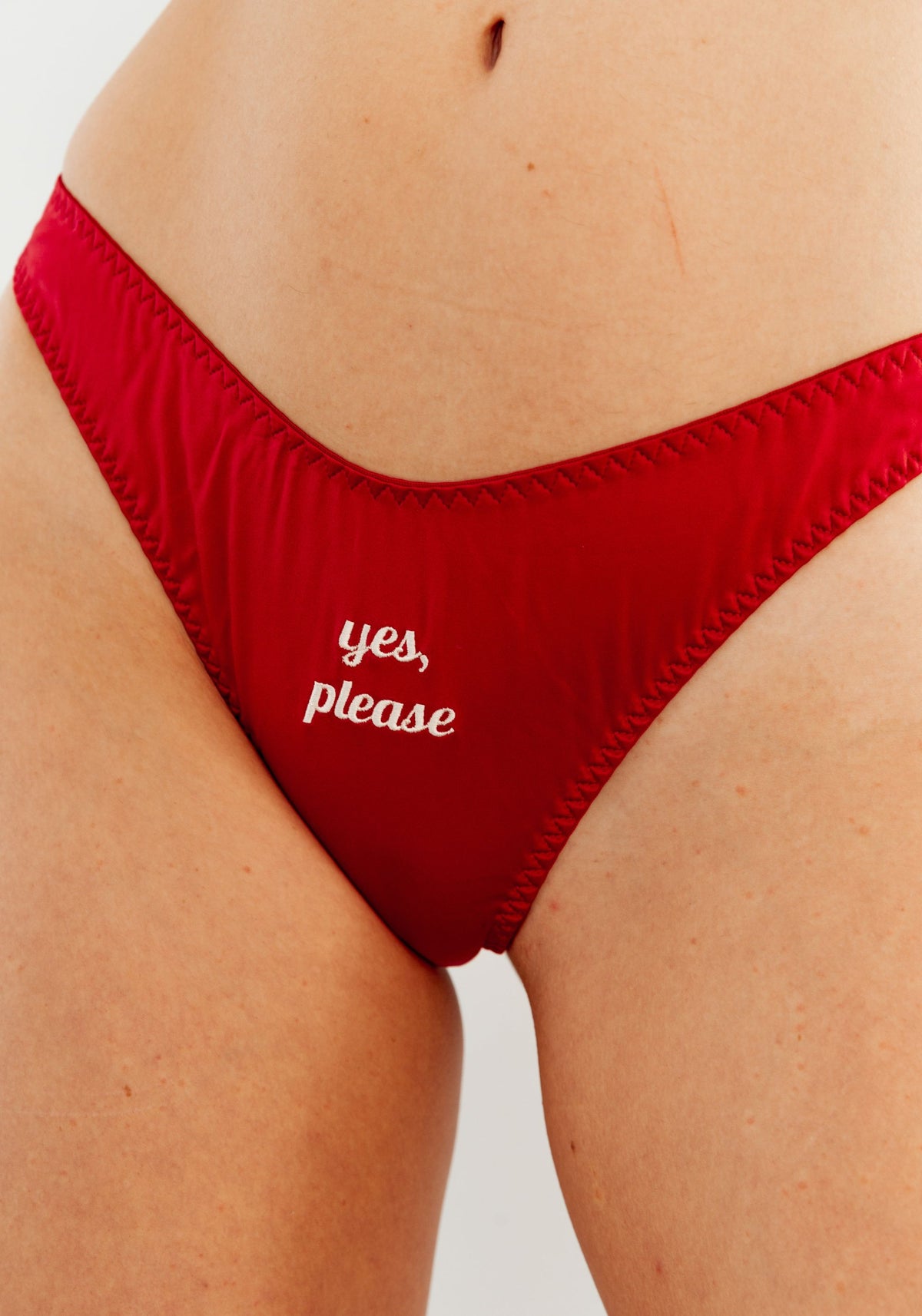 model is wearing an S panty-red play thong