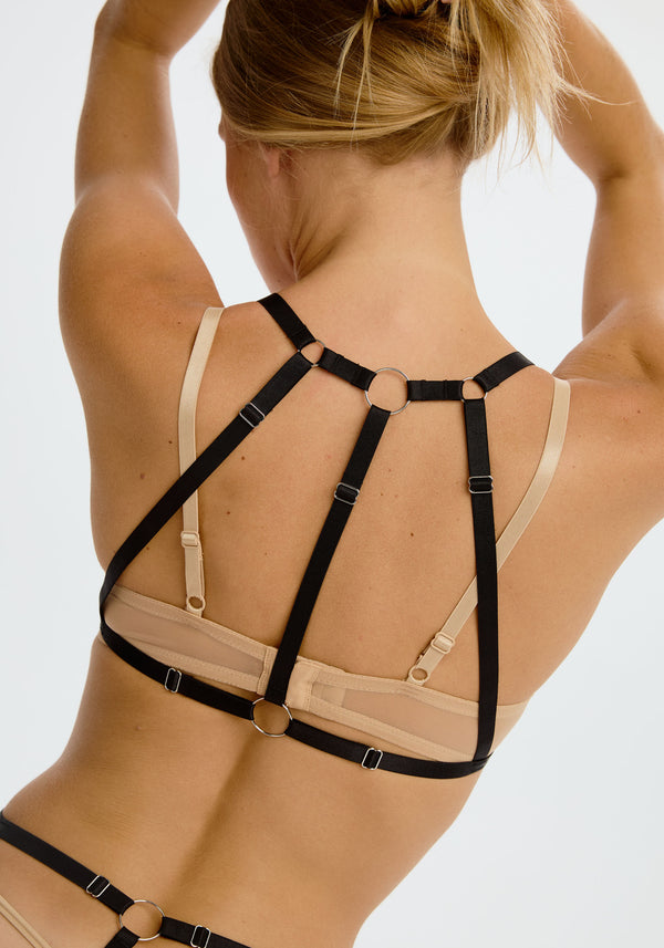 model is wearing a size 1 bra harness - black saint reversible bra harness