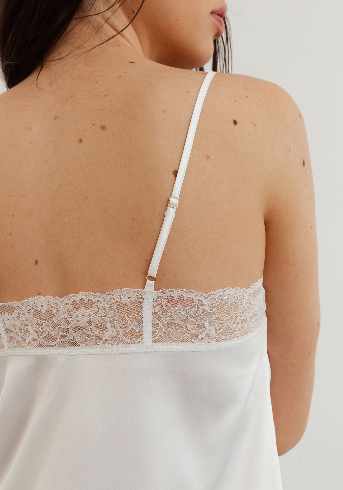model is wearing an S slip-white eden slip