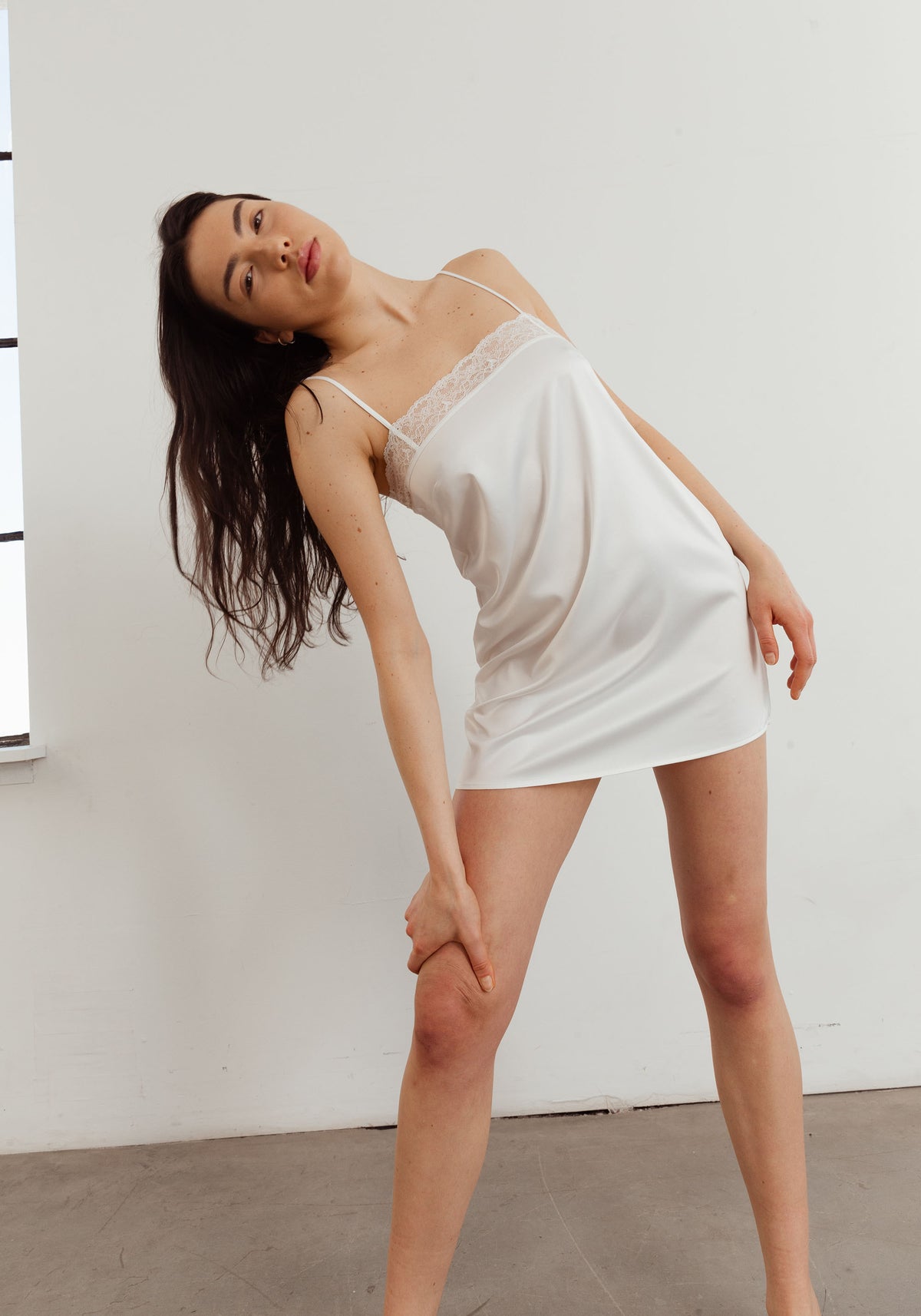 model is wearing an S slip-white eden slip