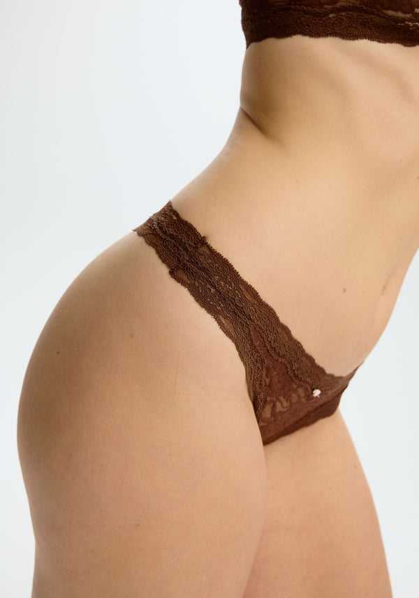 model is wearing an M panty - brown the lace rosette thong