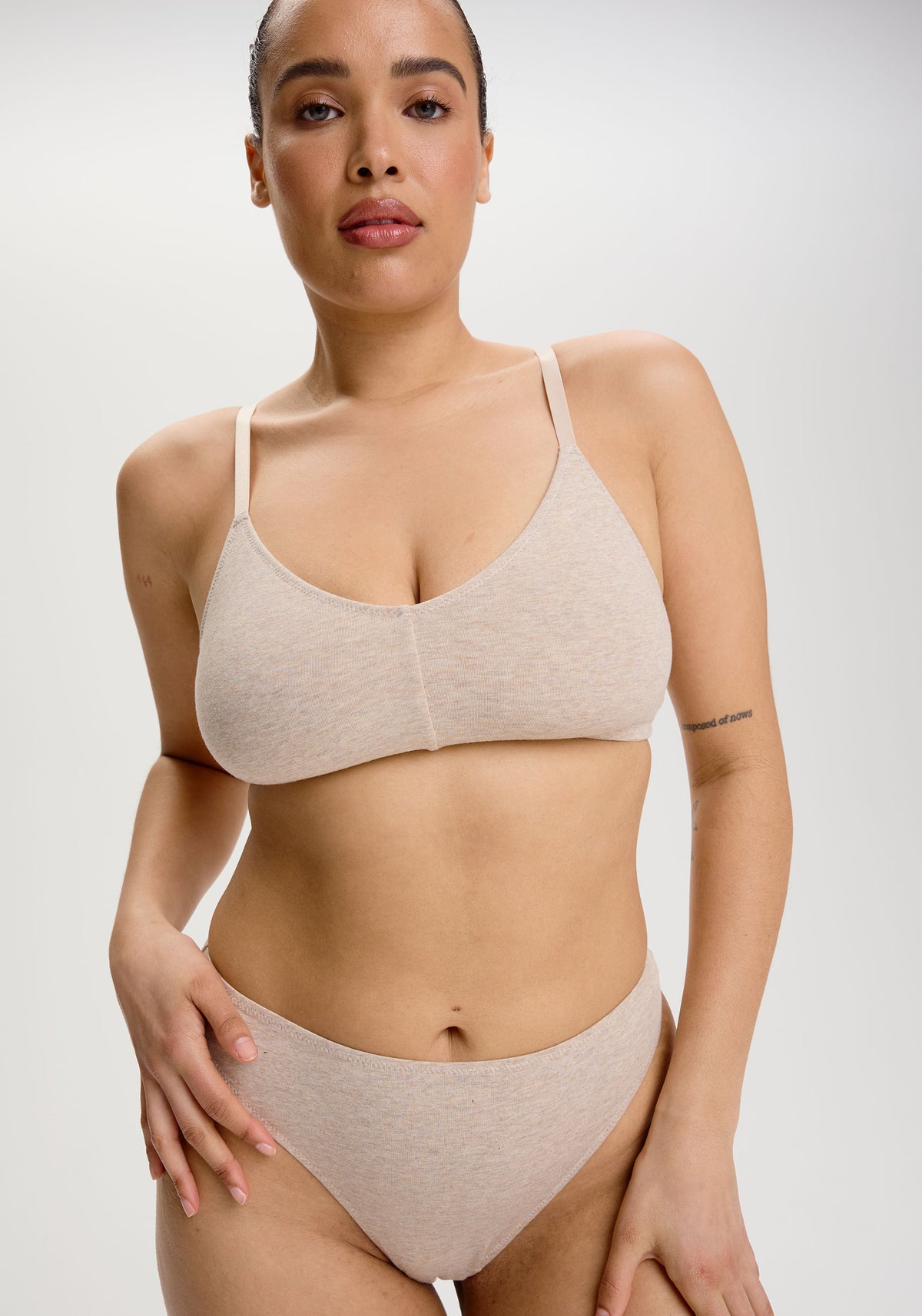 model is wearing an S+ bralette - nude the cotton bralette