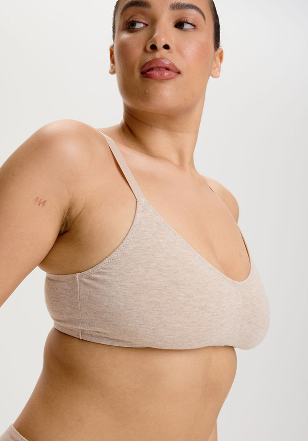 model is wearing an S+ bralette - nude the cotton bralette