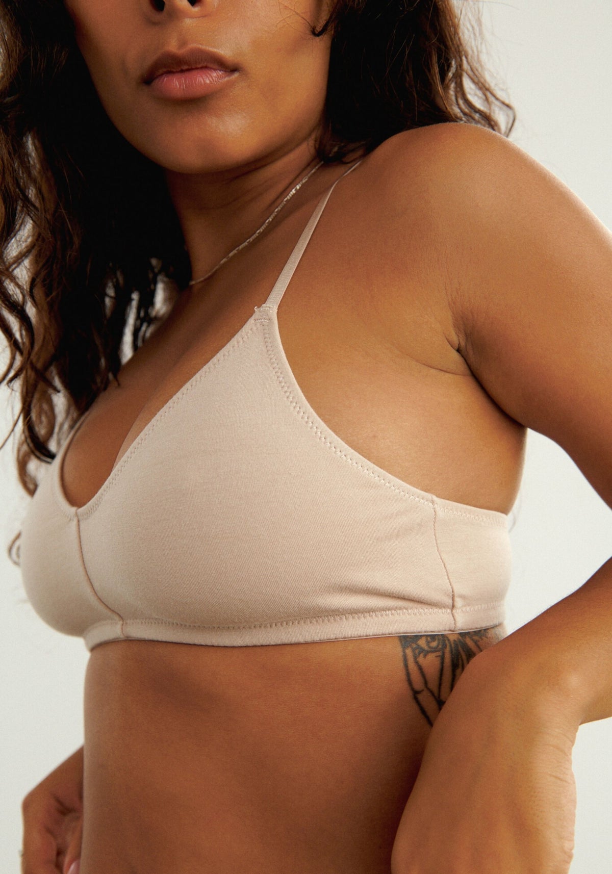 model is wearing an S bralette-nude the cotton bralette