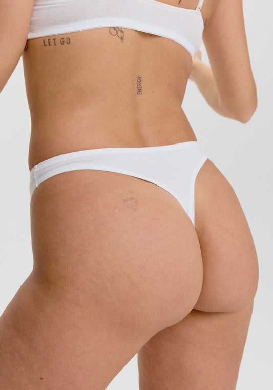 model is wearing an S panty-white the cotton high leg thong
