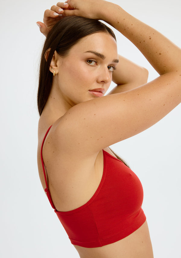 model is wearing an S cami - red the cotton crop cami