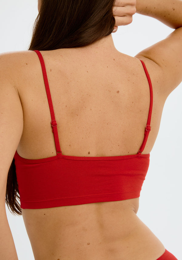 model is wearing an S cami - red the cotton crop cami