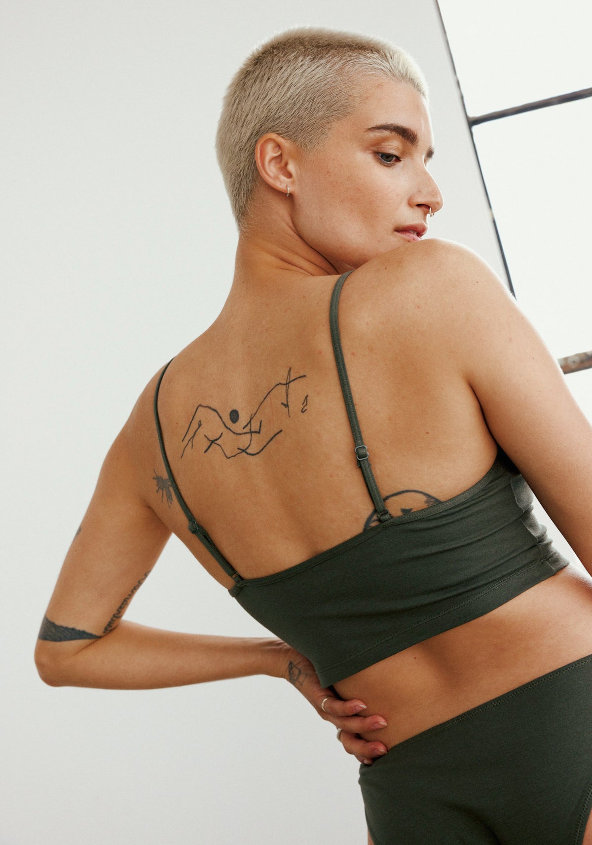 model is wearing an M cami - green the cotton crop cami