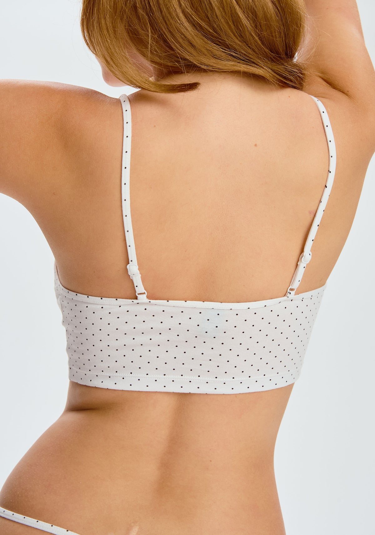 model is wearing an S cami-multi,white the cotton crop cami