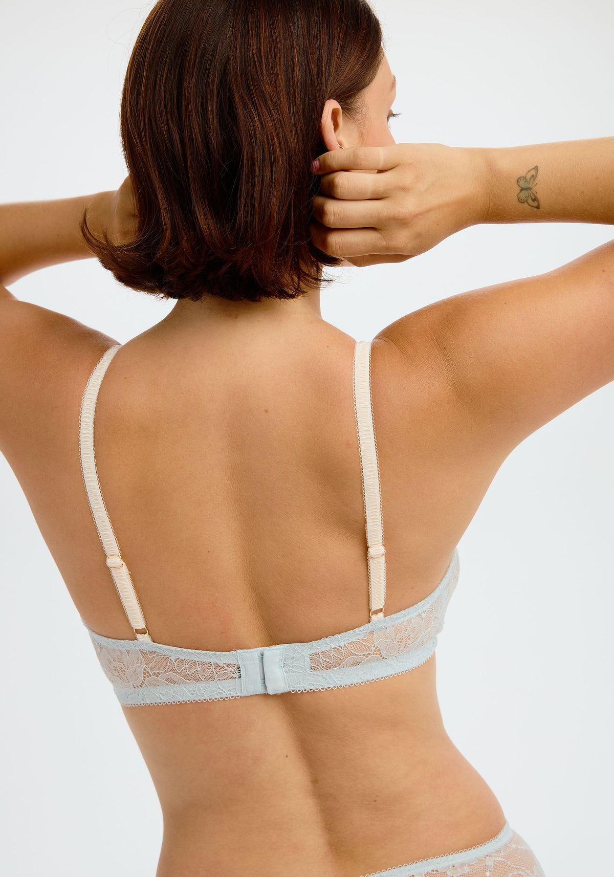 model is wearing an S+ bralette - blue bijou bralette