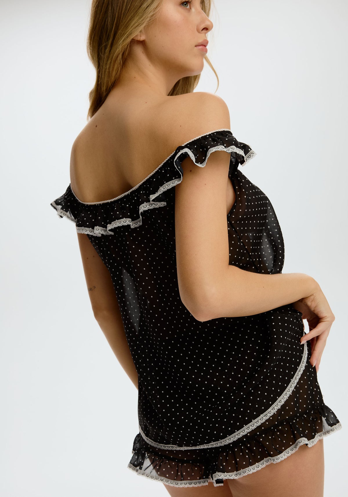model is wearing an S babydoll - black,multi delphine babydoll