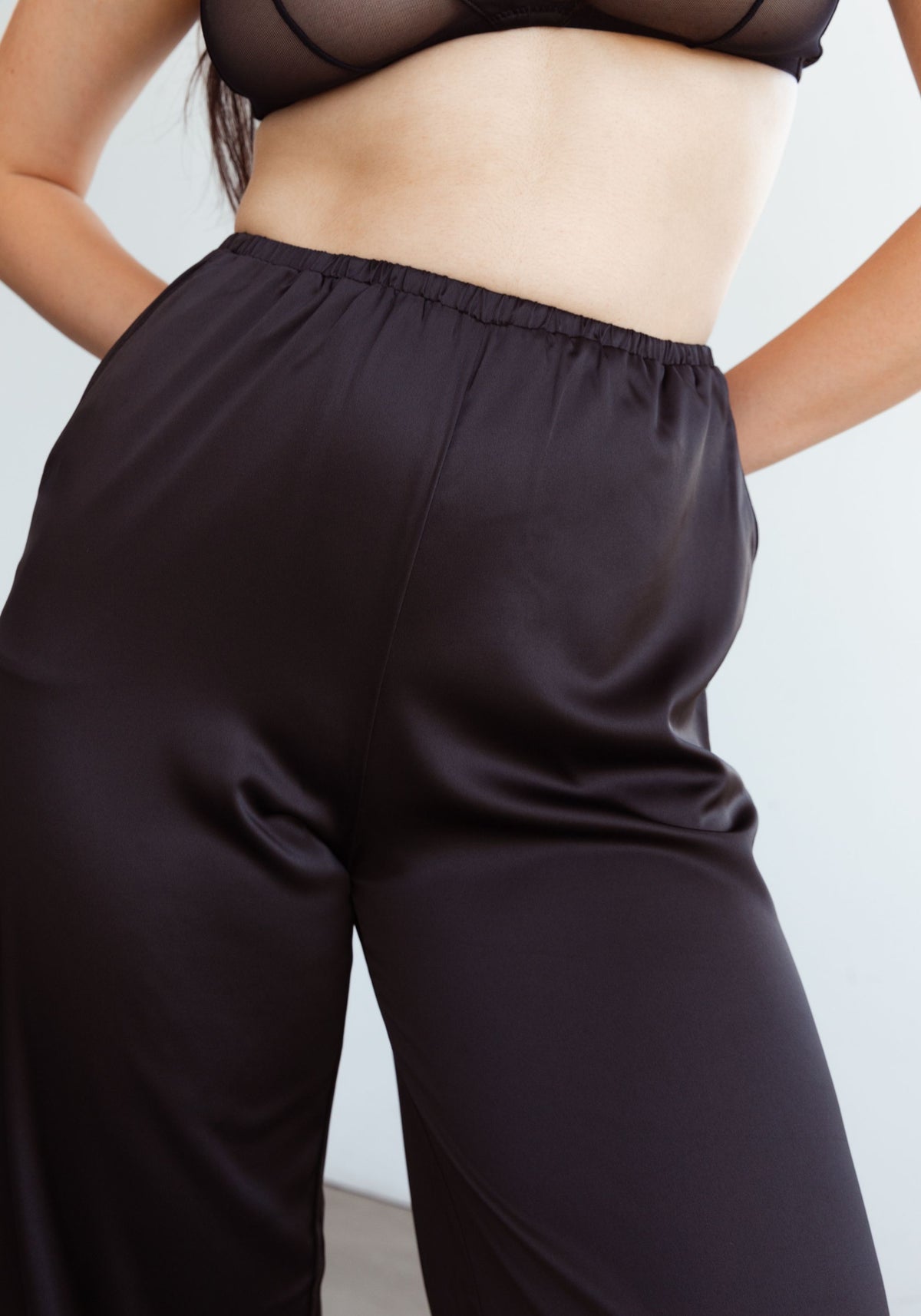 model is wearing an S pant-black after hours satin pant