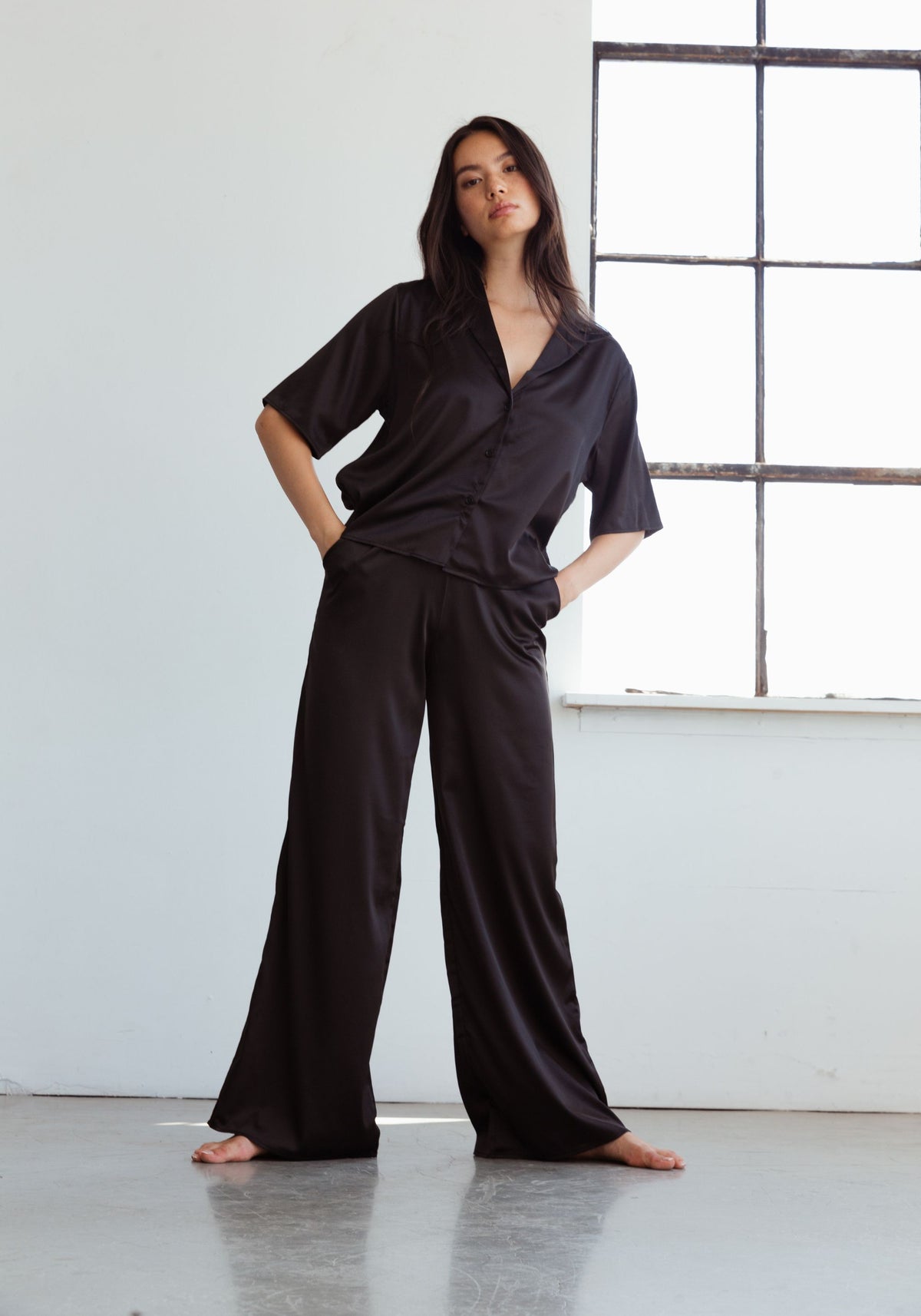 model is wearing an S pant-black after hours satin pant