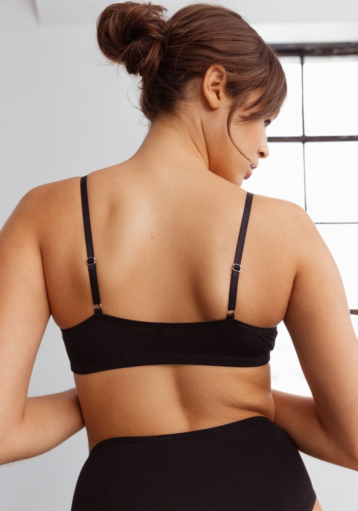 model is wearing an M bralette-black unplug modal bralette