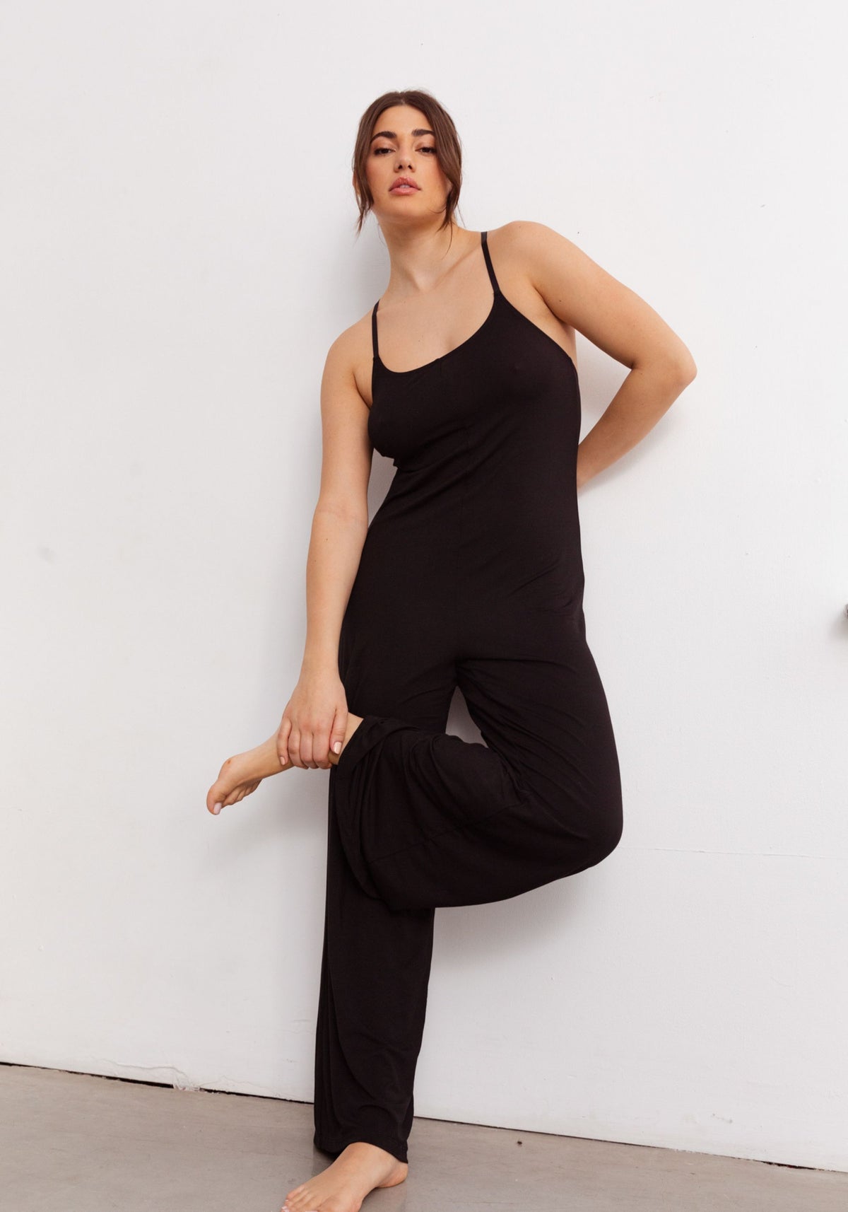 model is wearing an M jumpsuit-black unplug modal jumpsuit