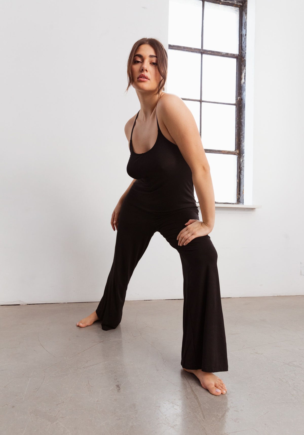 model is wearing an M jumpsuit-black unplug modal jumpsuit