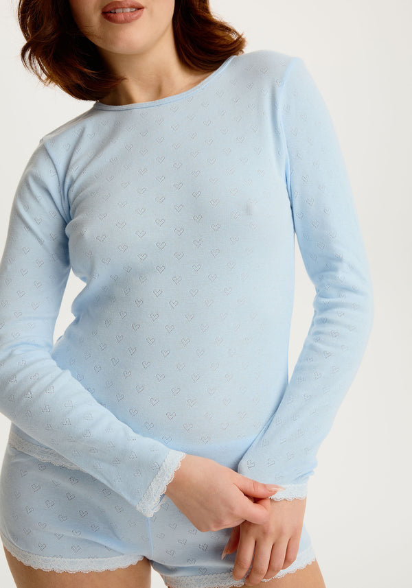 model is wearing an S top - blue cherish long sleeve top