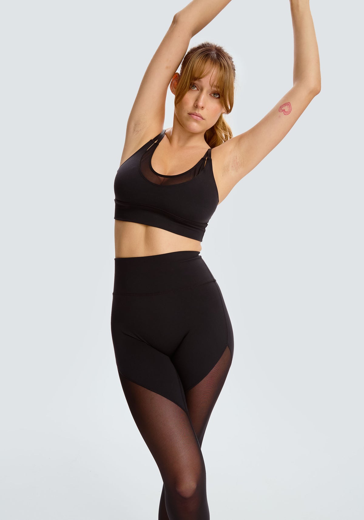 model is wearing an M sports bra-black pulse sports bra