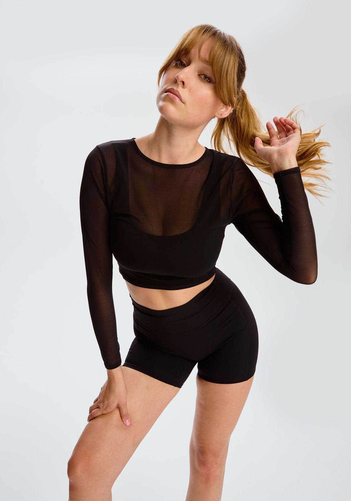 model is wearing an S top-black pulse long sleeve crop top