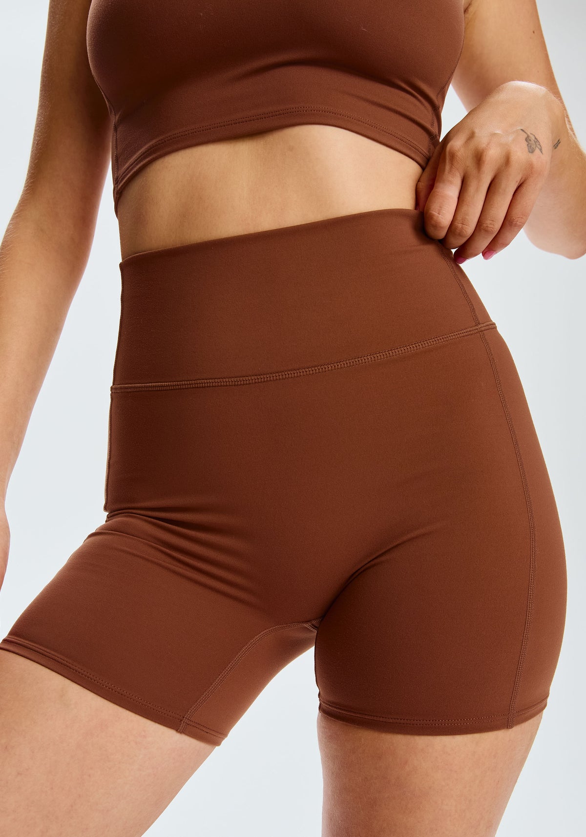 model is wearing an S short-brown core short