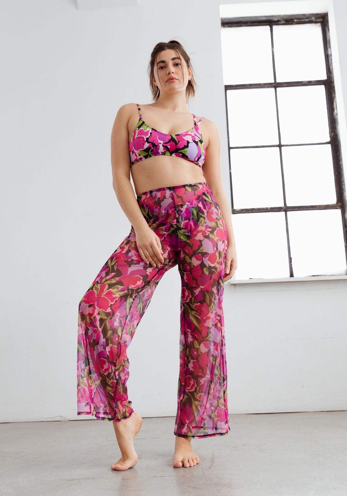 model is wearing an L bikini top-multi mirage scoop bikini top